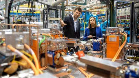Georg Hoffstaetter, professor of physics, and Alicia Barton, president and CEO of the New York State Energy Research and Development Authority, tour the Cornell-Brookhaven ERL Test Accelerator facility. 